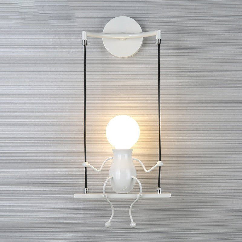 Moderne Wandleuchte mit Schaukelfigur - SwingDesign